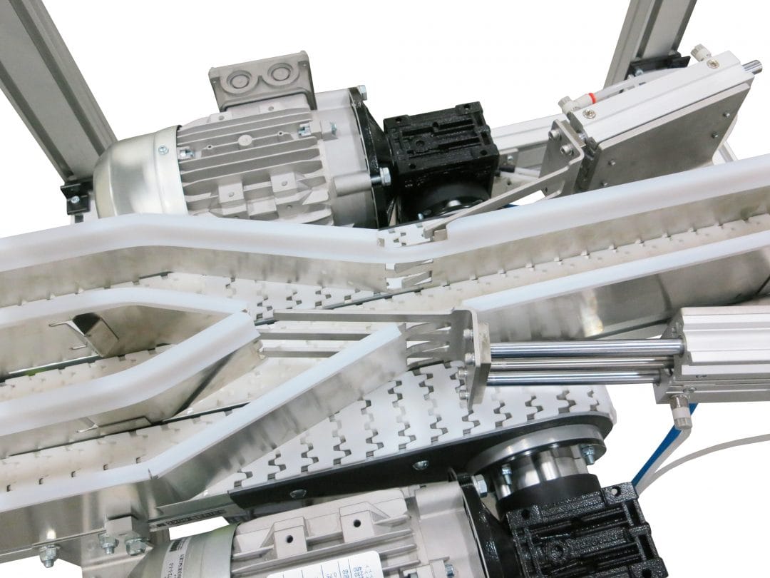 Conveyor merge point with multiple lines converging